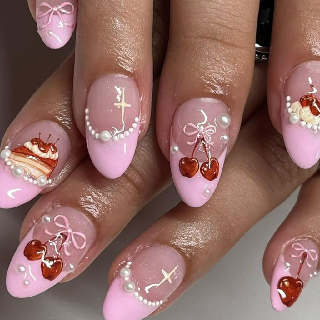 Sweet birthday cake nails with pink French tips and pearl accents in an elegant design
