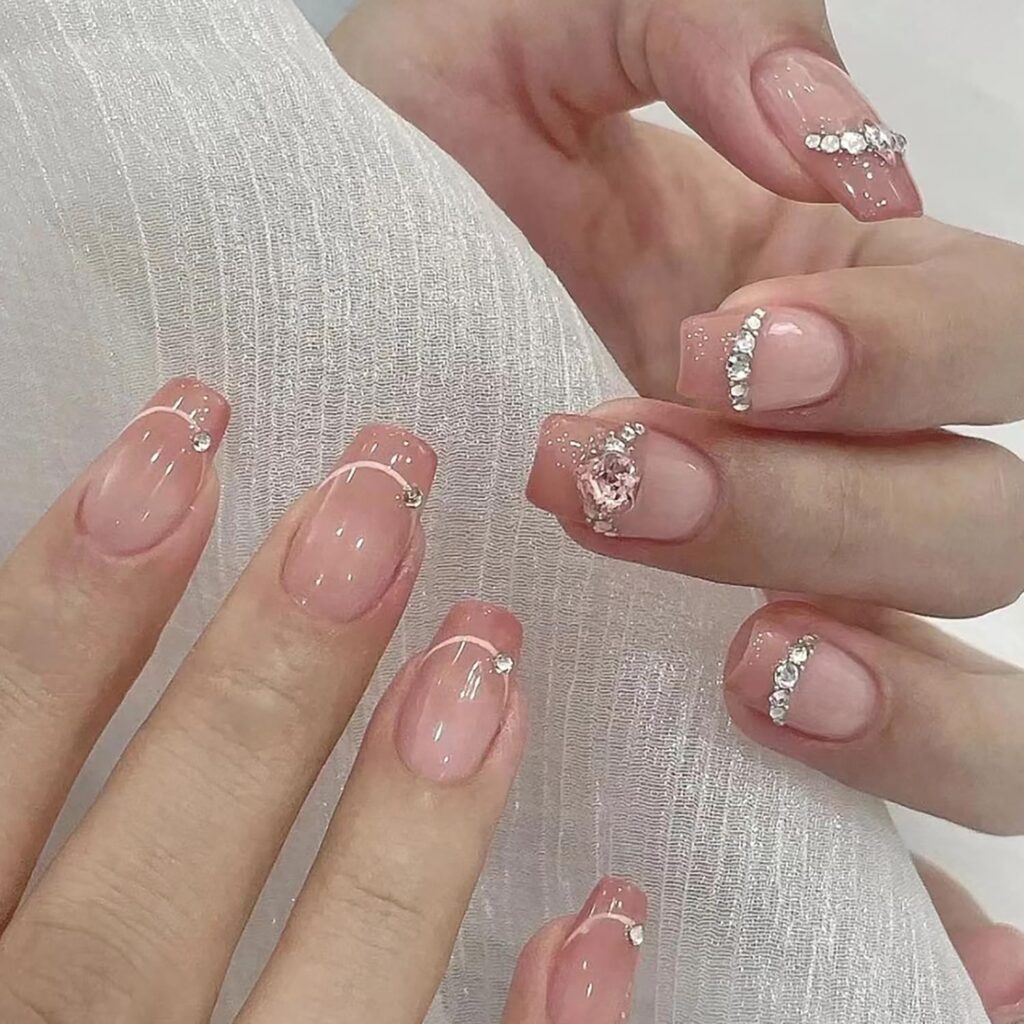 Valentine nail designs with nude square nails and heart gem accent